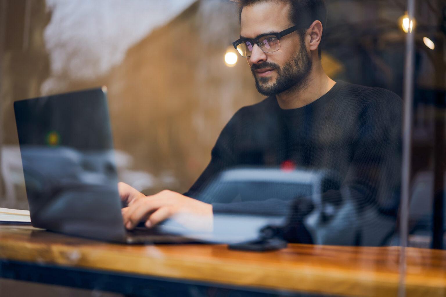 Person with glasses working